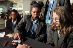 Students using microbits at the STEM skills fair.