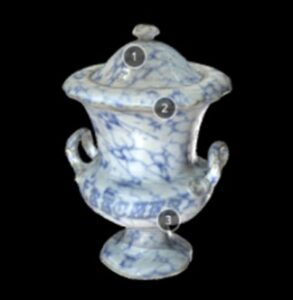 A blue and white vase with two handles with the word leeches written across the front